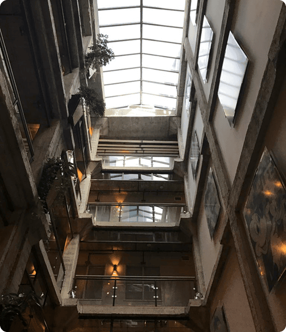 Glass-ceilinged atrium with multiple floors